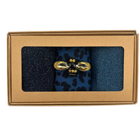 Denim mix sock box with golden eye pin